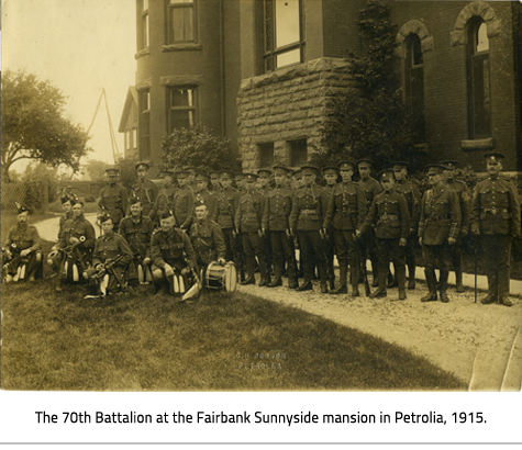 Photo of uniformed solders in front of a large building, link.