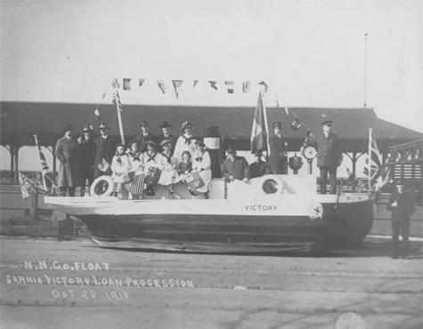 Photo of a parade float shaped like a boat, link.