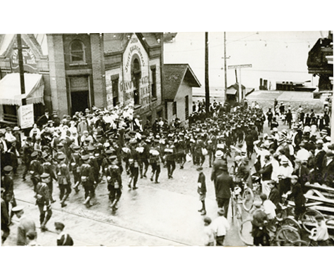 Photo of uniformed officers leaving for Europe, link.