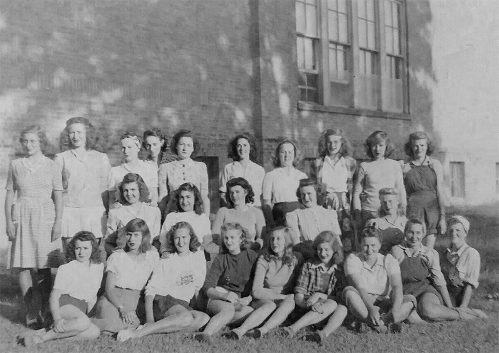 A group of Farmerettes outside of the Forest High School.