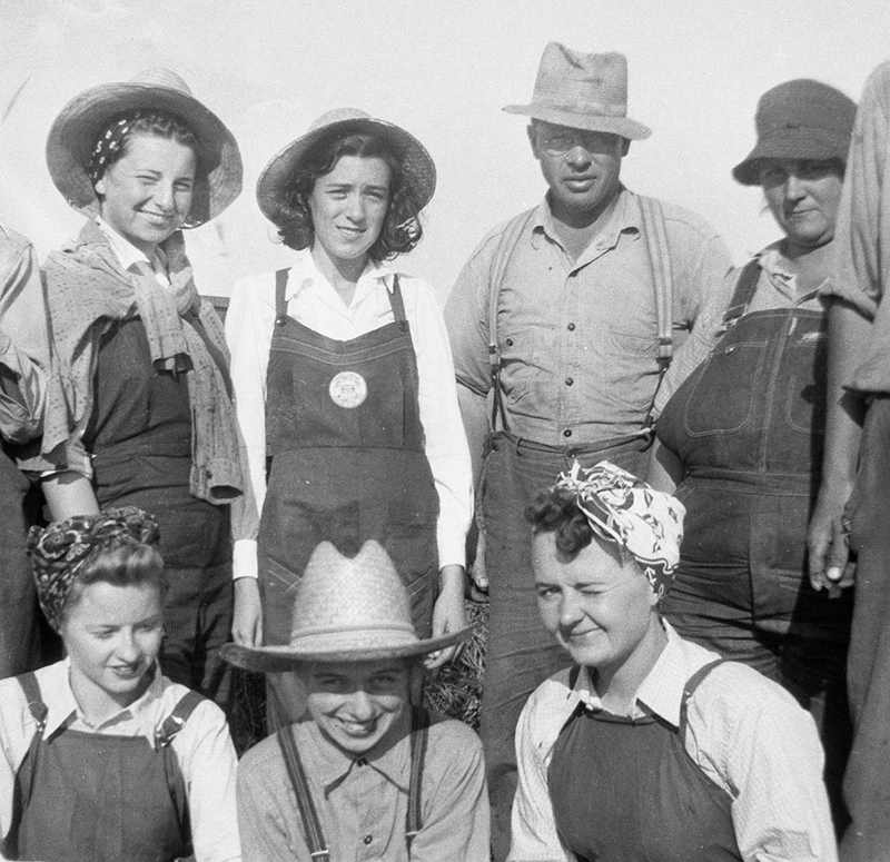 Janet Howes Hassan with other Farmerettes and Farmer Bob Love.