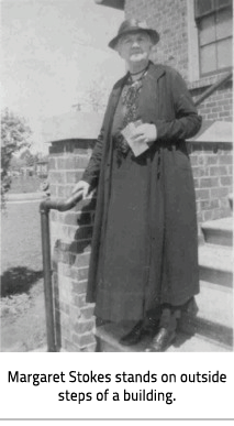 (Image Caption:"Margaret Stokes stands on outside steps of a building"), link.