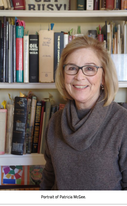 (Woman standing in front of a bookcase. Image Caption:"Portrait of Patricia McGhee"), link.