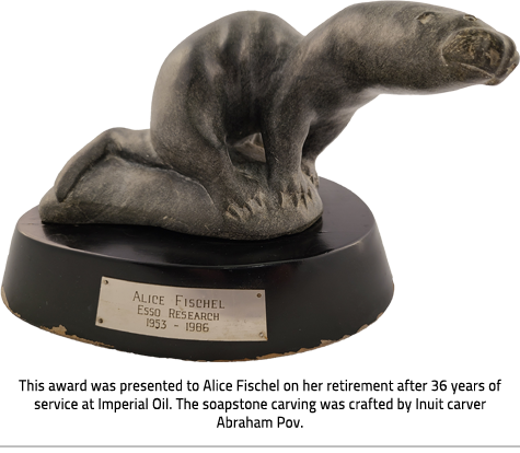 (Award with carved otter on a round base. Plaque reads "Alice Fischel Esso Research 1953-1986"Image Caption: "This award was presented to Alice Fischel on her retirement after 36 years of service at Imperial Oil. The soapstone carving was crafted by Inuit carver Abraham Pov."), link.