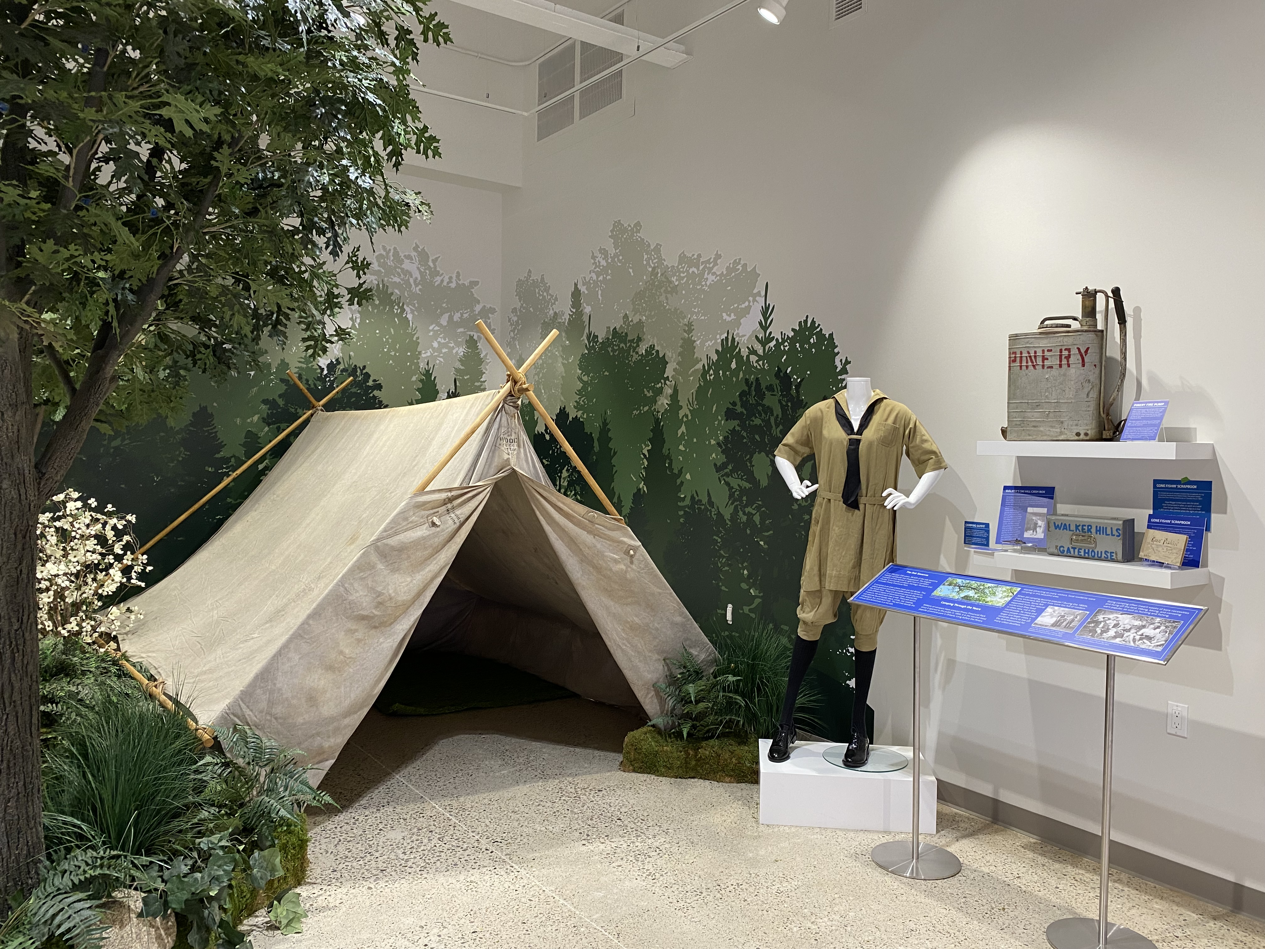 A section of the new Lambton Gallery featuring a large canvas tent amongst fake trees and foliage.