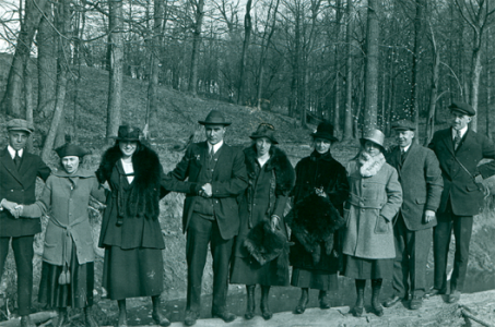 People standing outside in winter clothing.