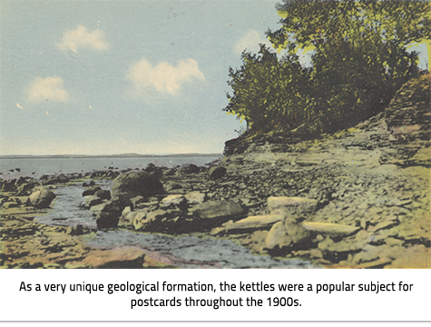 )A colourful postcard of a stony beach. Large stone spheres rise out of the water and the beach. Image Caption: "As a very unique geological formation, the kettles were a popular subject for postcards throughout the 1900s. "), link.