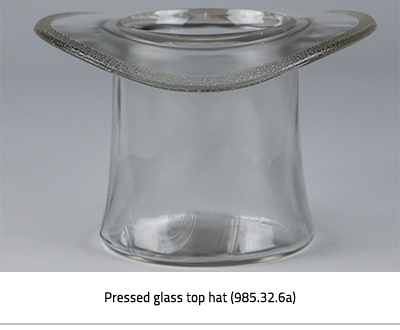 Top Hat made of pressed glass. Image Caption: "Pressed Glass top hat (985.32.6)"), link.