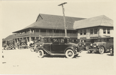 (Black and white postcard showing the Lakeview Casino from the side. Outside there are many cars parked outside.), link.