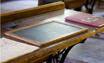 Chalkboard on a desk.