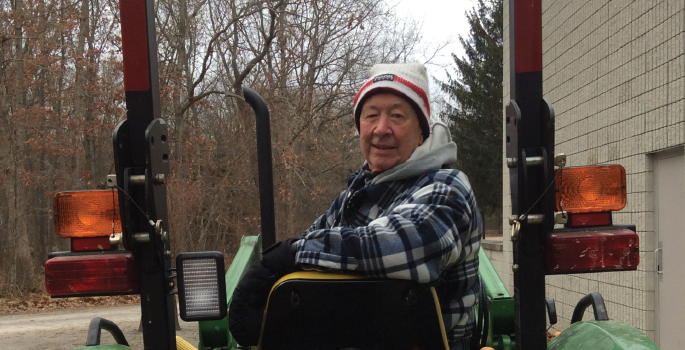 Man sitting on tractor.