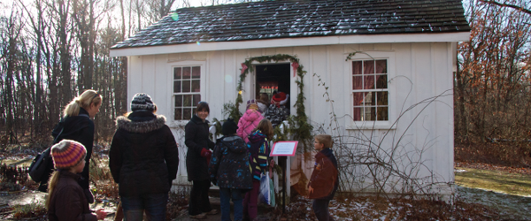 A school group visits the Tudhop home.