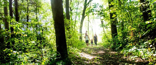 Family walking the Woodland Heritage Trail.