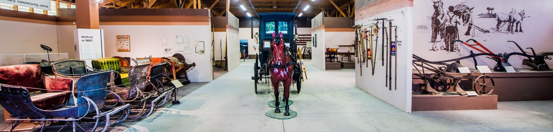 Horse and buggy in barn.