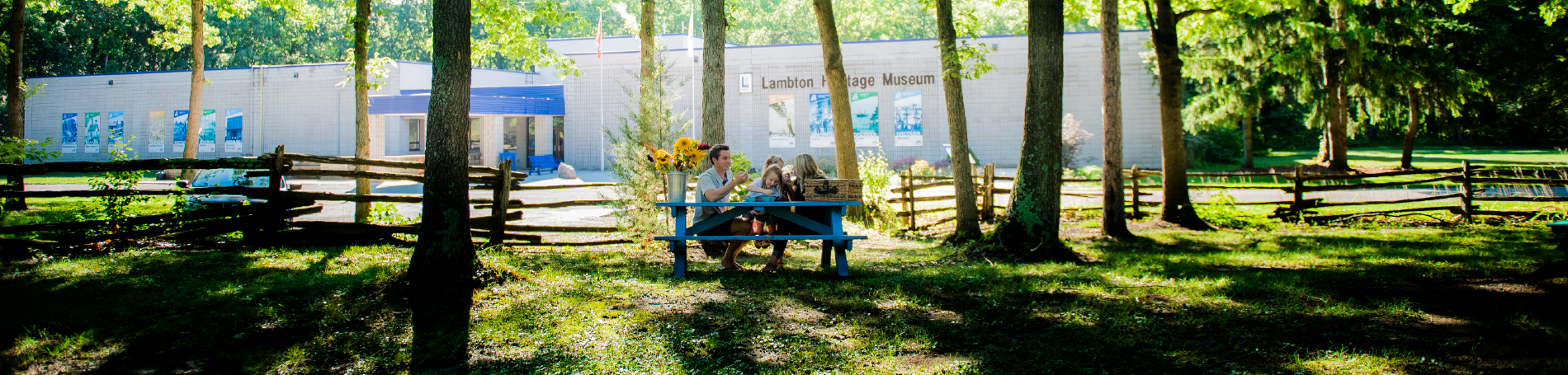 Family enjoying themselves outside of Lambton Heritage Museum