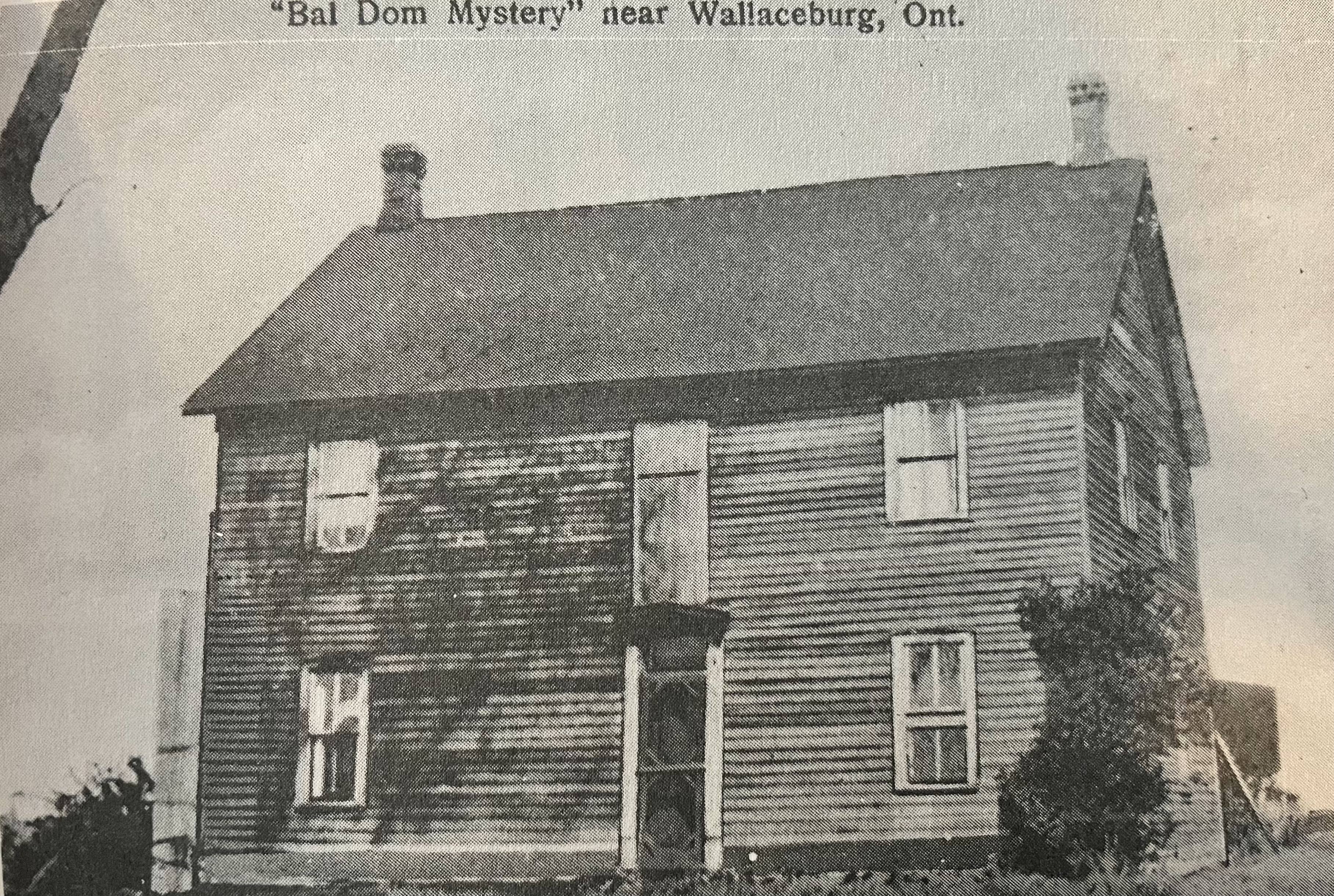 Black and white image of a house with text, "Bal Dom Mystery" near Wallaceburg, Ont."