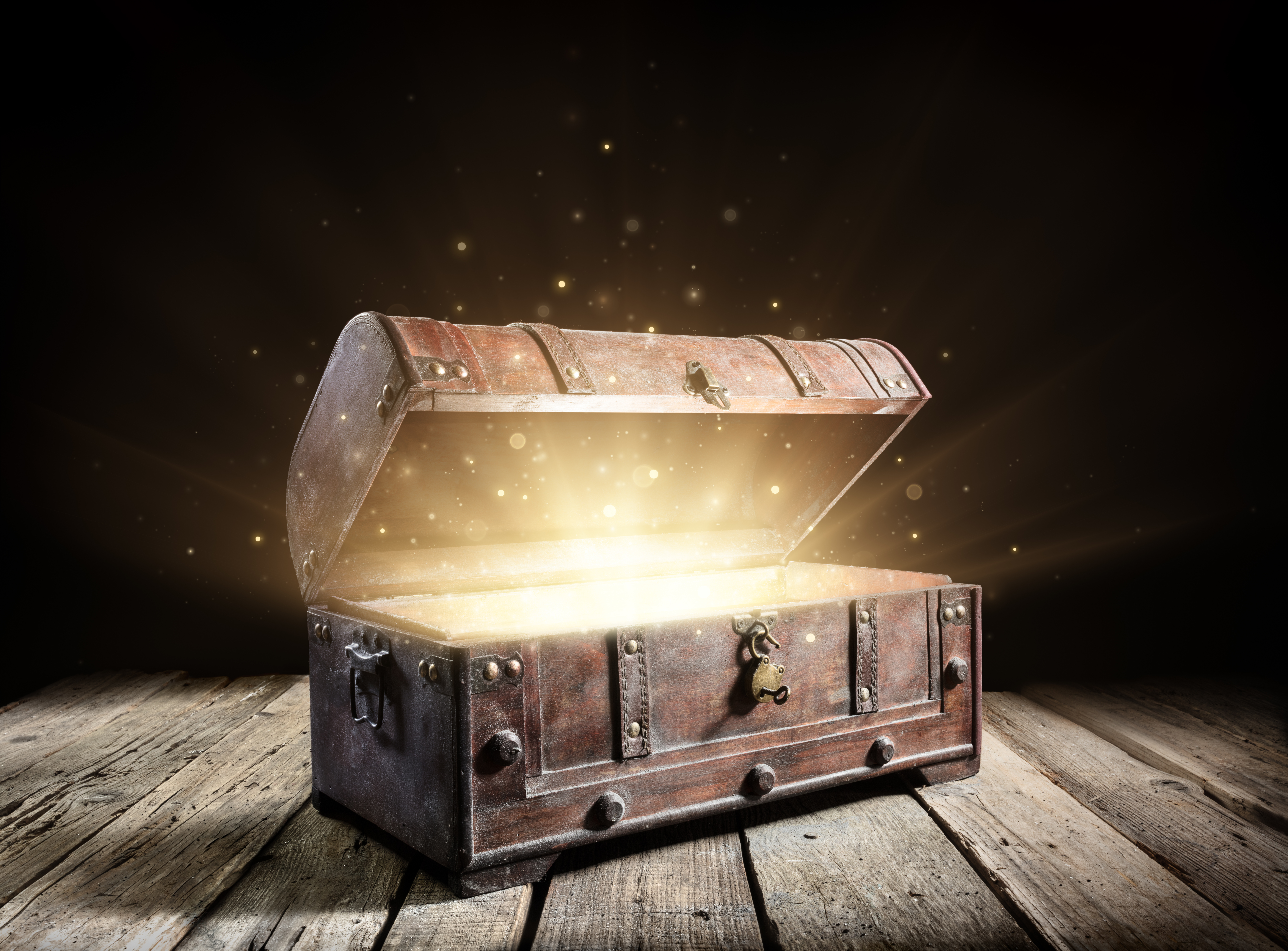 Treasure ;chest with light coming out of it.
