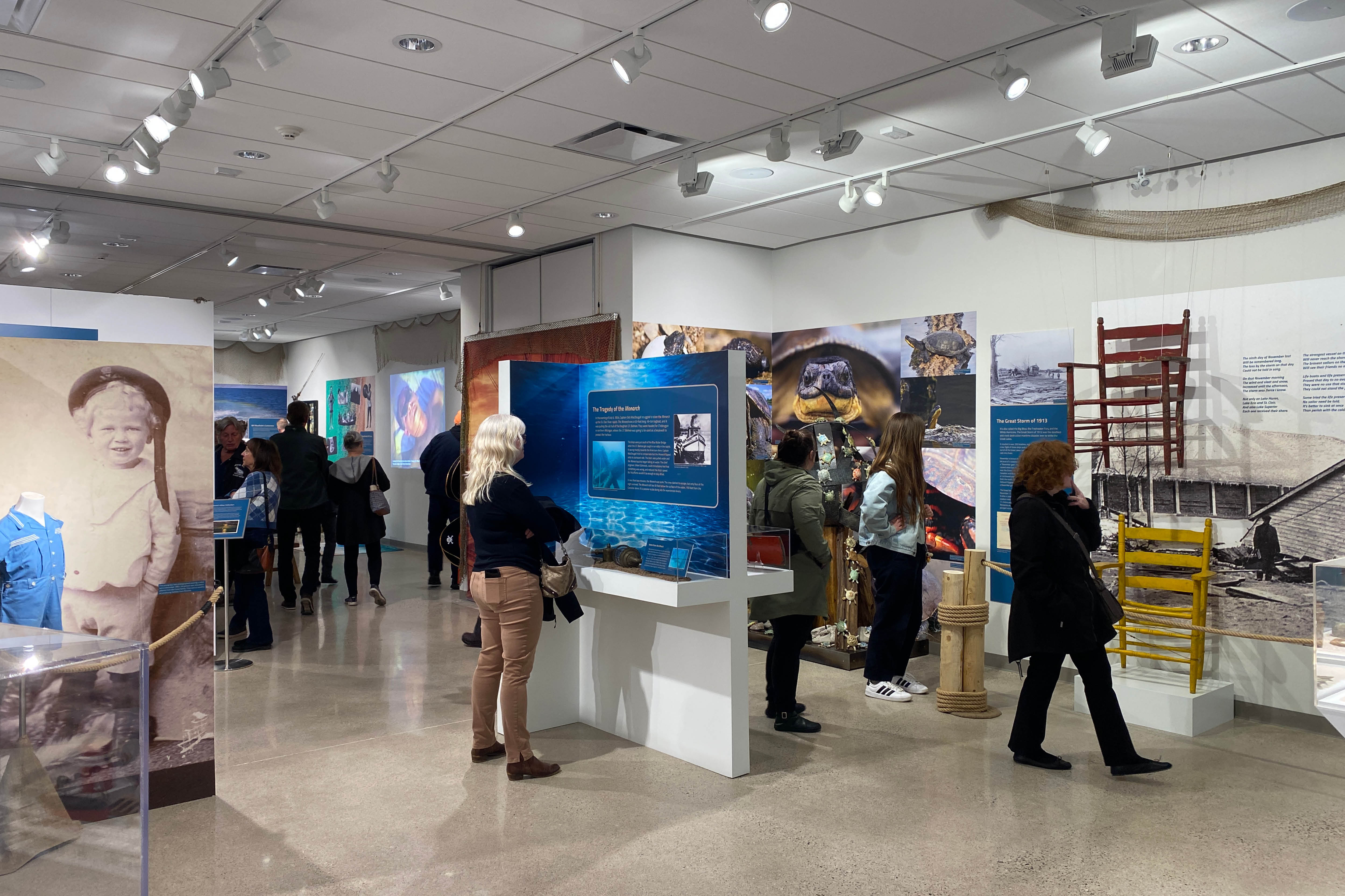 Visitors explore the feature exhibition Bluewaterland at Lambton Heritage Museum.