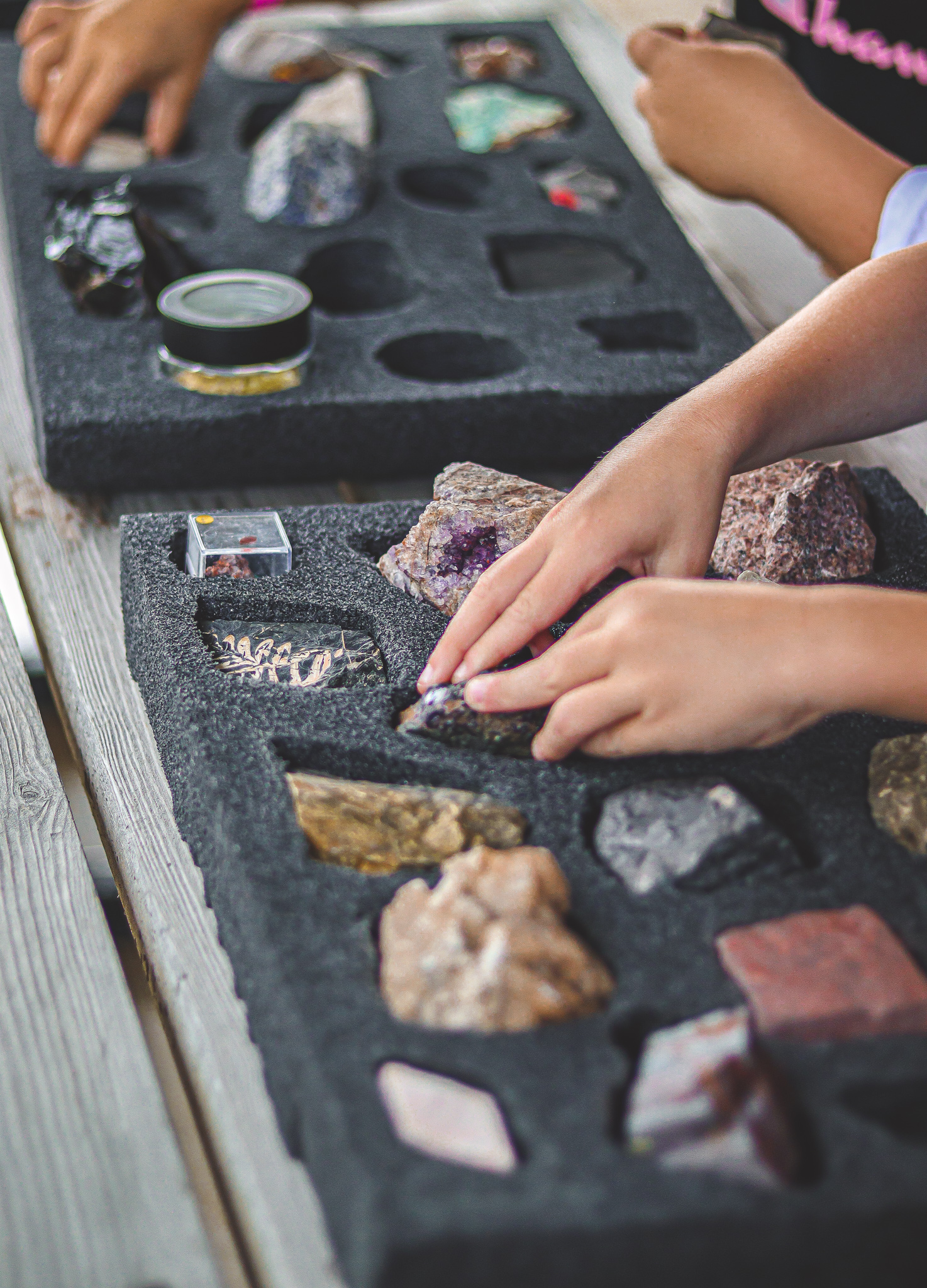 Children explore geology specimens at the Oil Museum of Canada