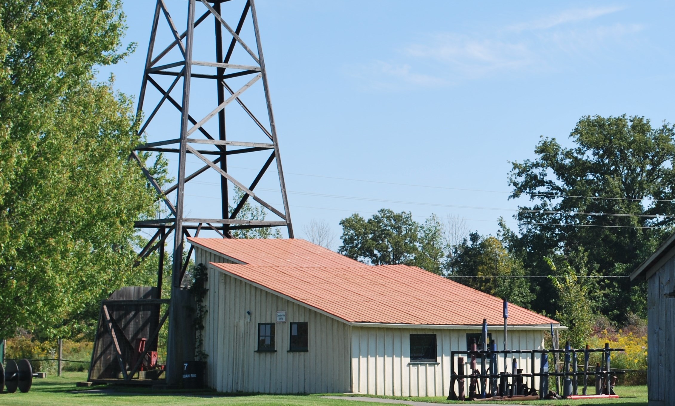 Adults boarding a school bus parked outside of the Museum.