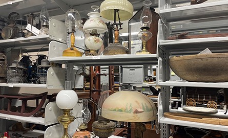 Artifacts on shelving from the Oil Museum of Canada's collection.