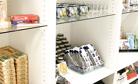 Display of items on glass shelves.