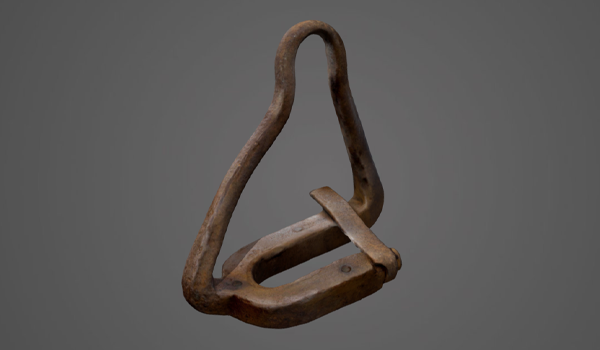 A rusted metal object called a pipe elevator clamp.