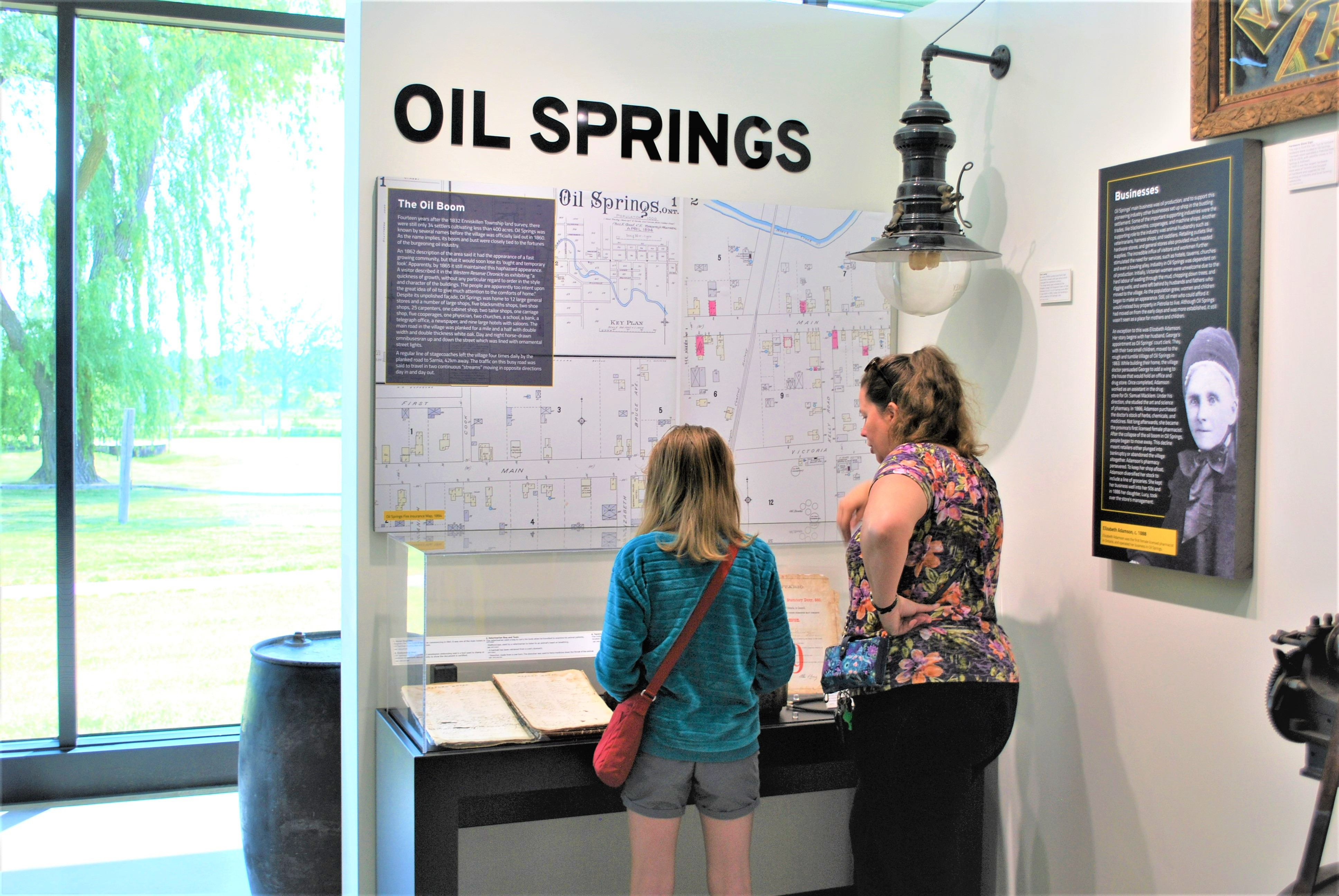 woman and child looking at exhibit