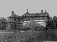 Black and white image of the outside of a house.